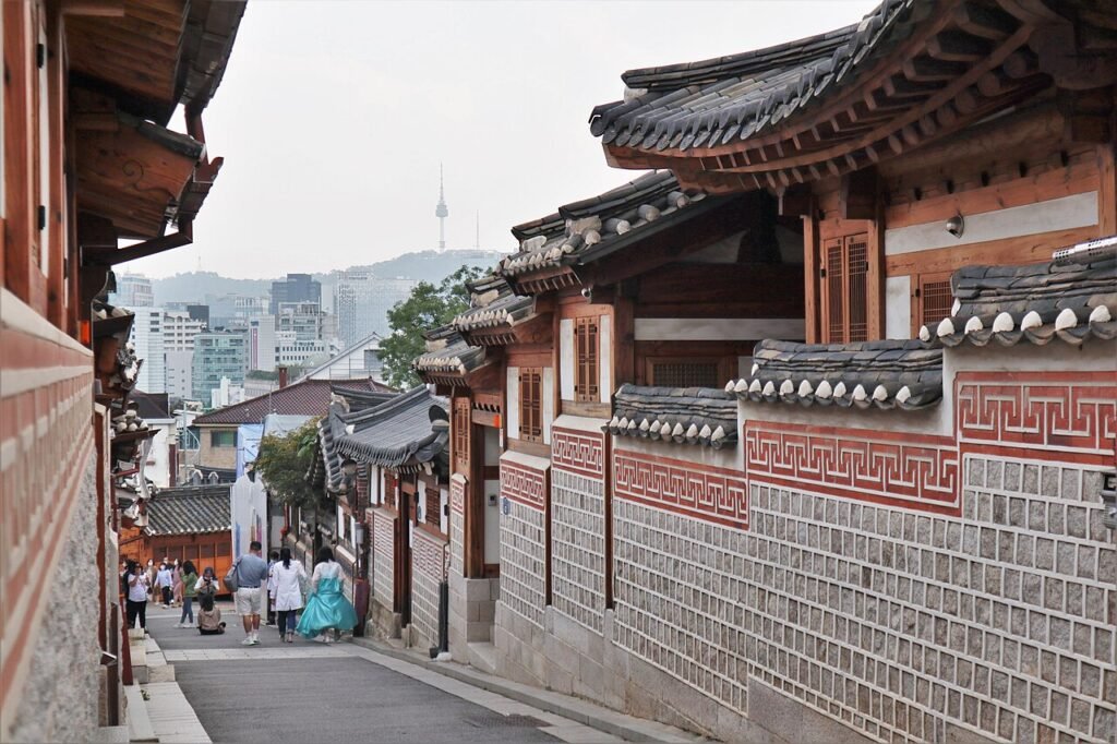 Traditional hanok rooftops along an alley in Bukchon Hanok Village, Seoul