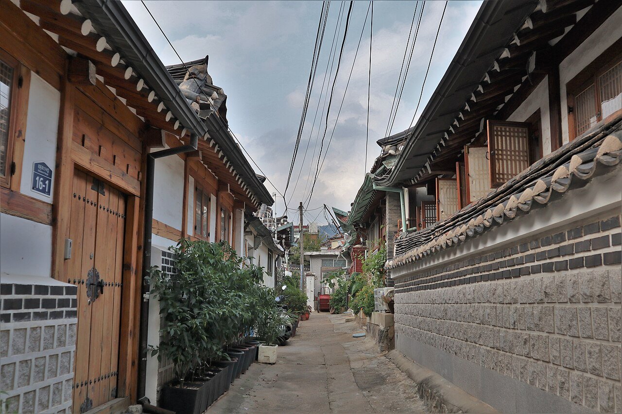 Stone-paved street between traditional Korean houses in Bukchon Hanok Village
