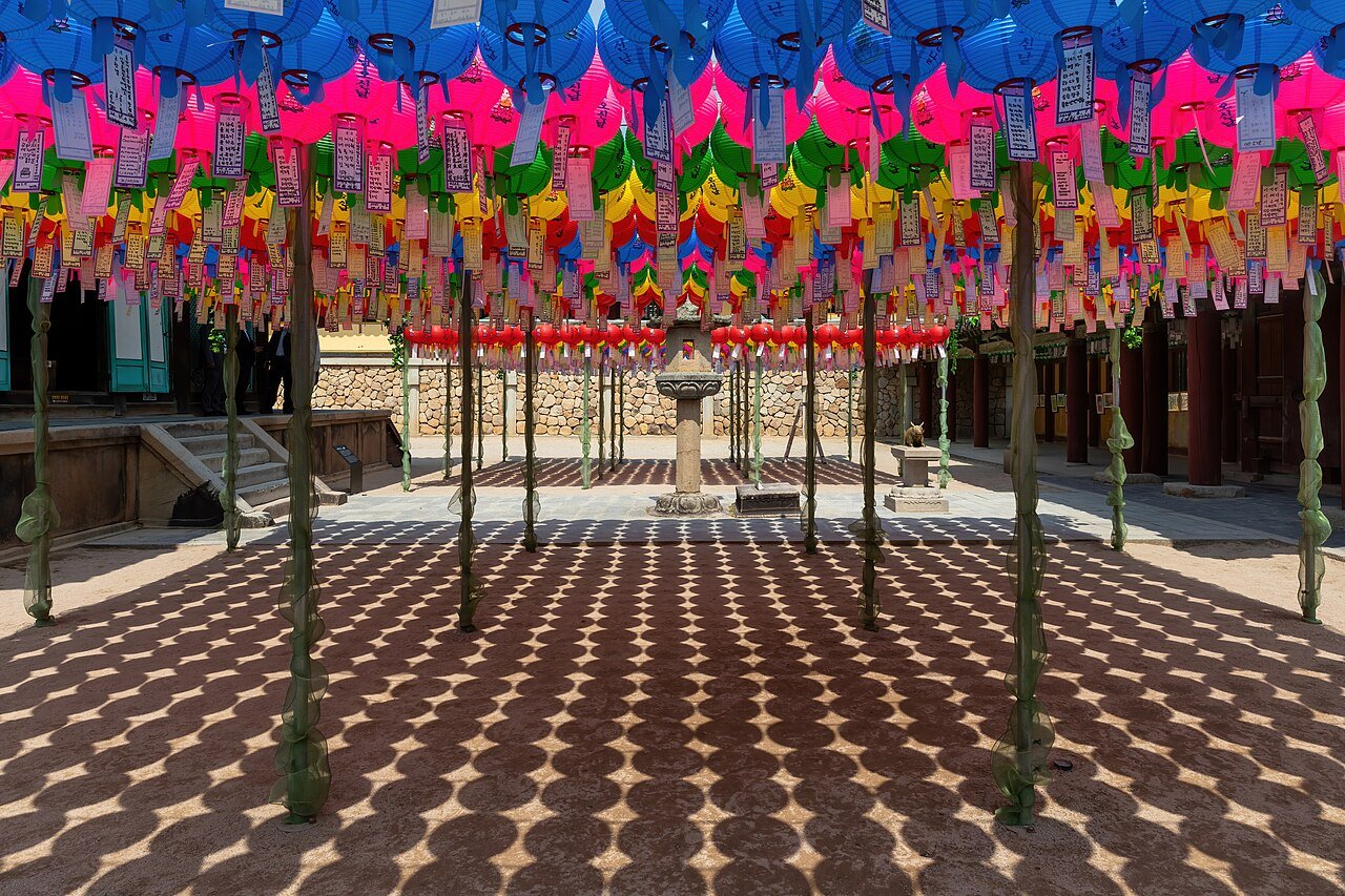 Colorful paper lanterns strung across a courtyard of Bulguksa Temple