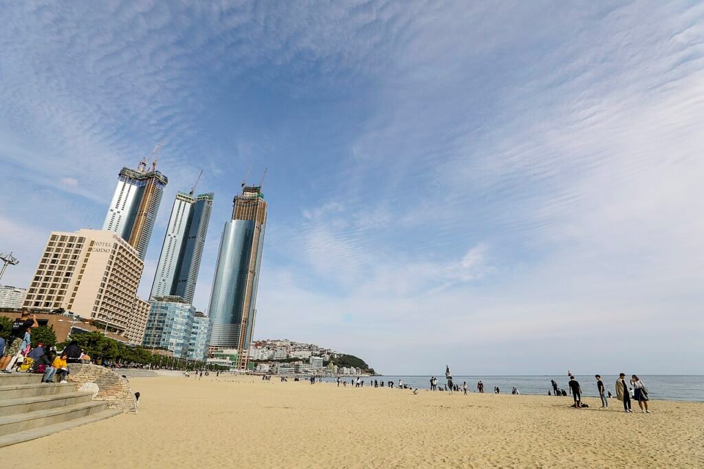 Haeundae Beach shoreline with the Busan city skyline behind
