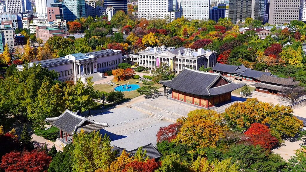 Deoksugung Palace among autumn foliage in central Seoul