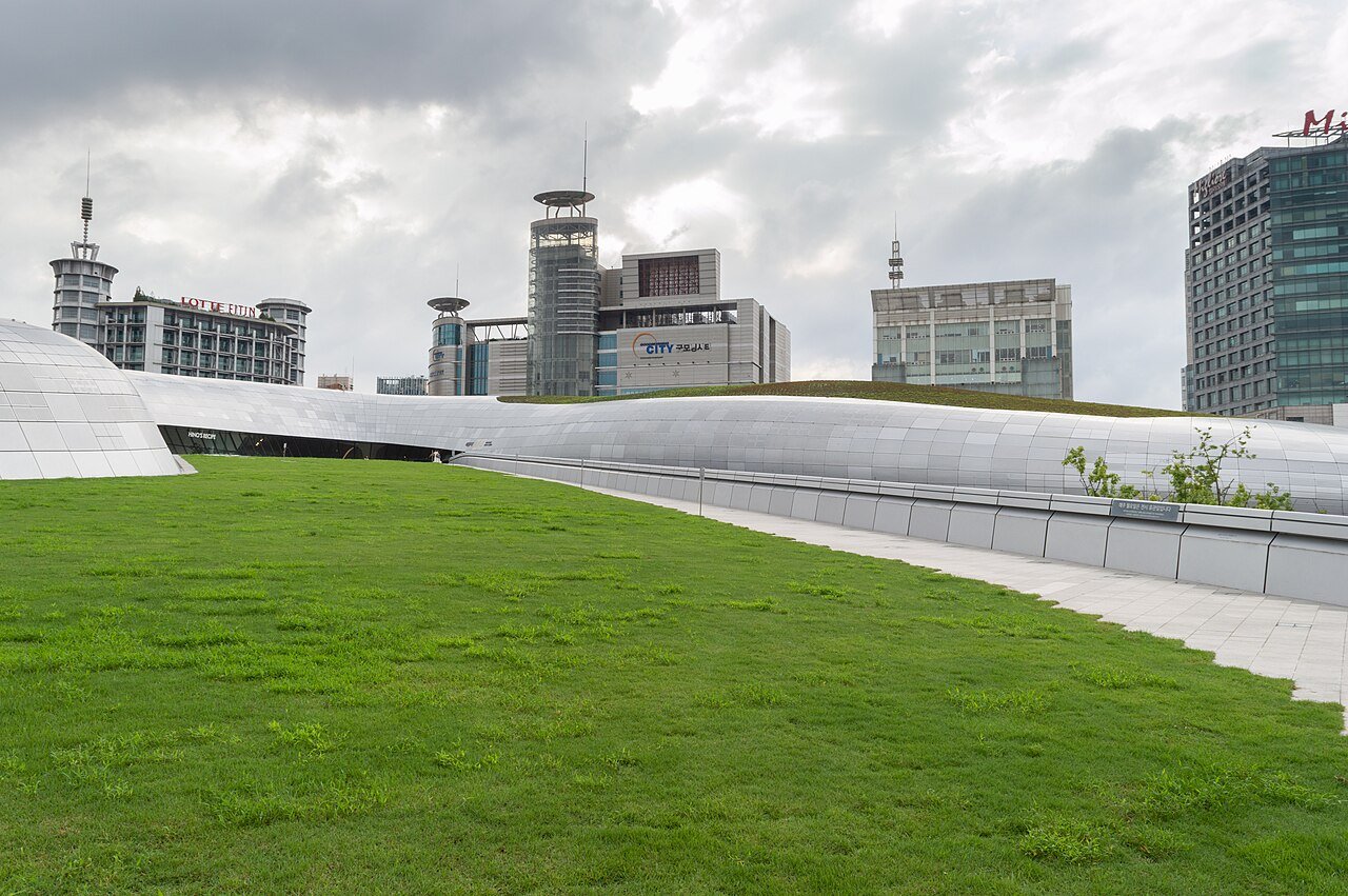 Grass-covered rooftop ramp of Dongdaemun Design Plaza in Seoul