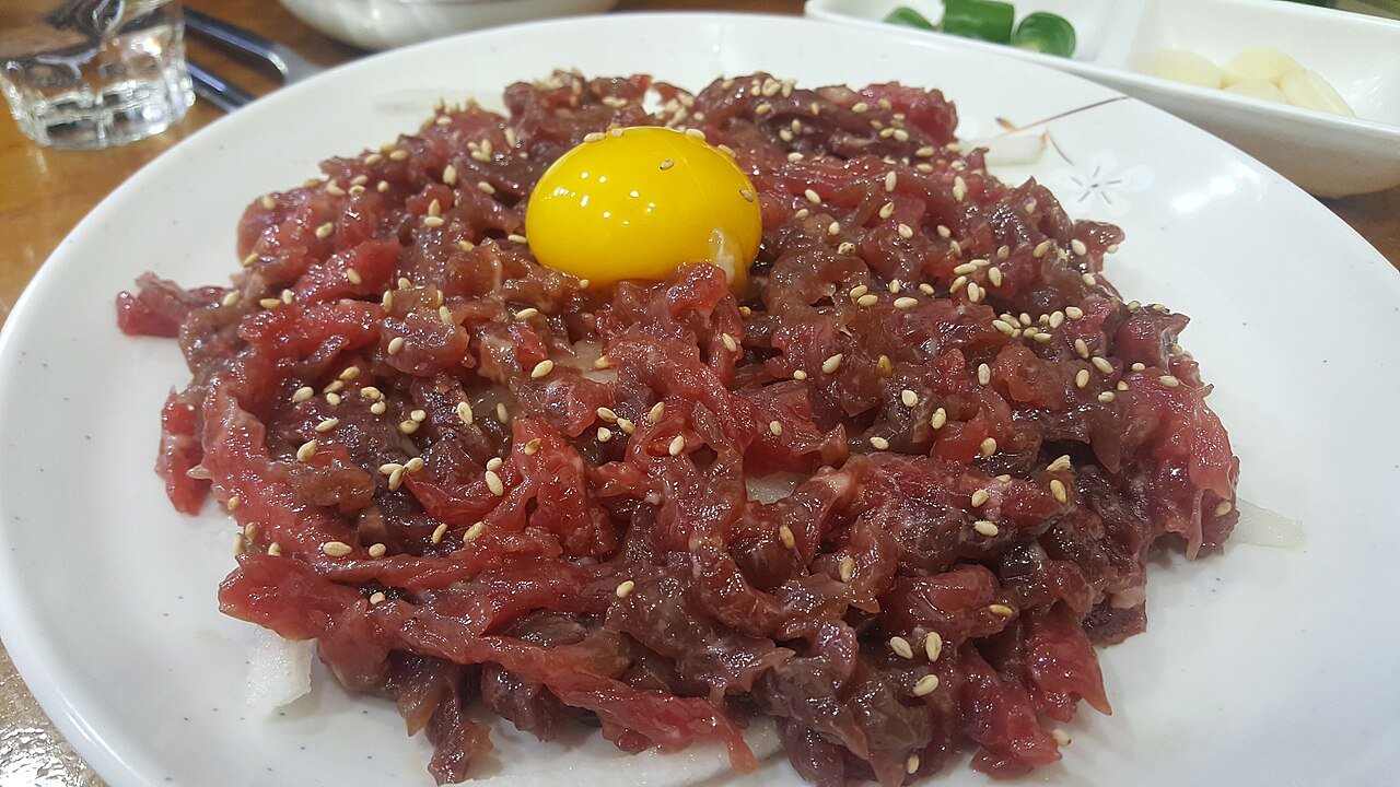 Yukhoe, Korean seasoned raw beef with egg yolk, at Gwangjang Market