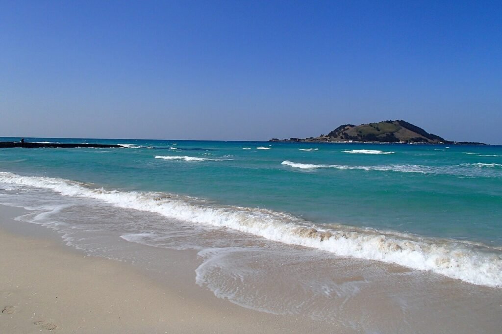 Turquoise water and white sand at Hyeopjae Beach on Jeju Island