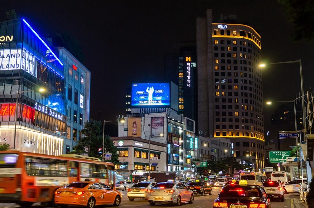 Namdaemun-ro and the Myeongdong shopping district lit up at night in Seoul