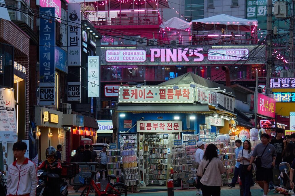 Neon-lit street in the Hongdae district of Seoul at night