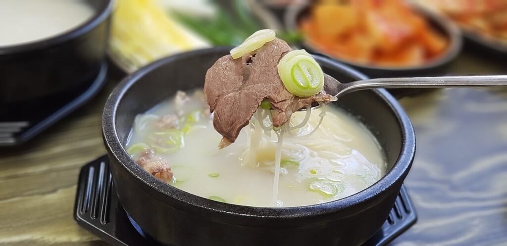 Bowl of seolleongtang, milky Korean ox bone soup served in Dongdaemun eateries