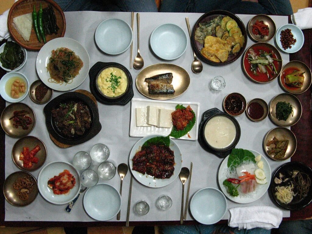 A spread of Korean home-style dishes on a country table (bapsang)