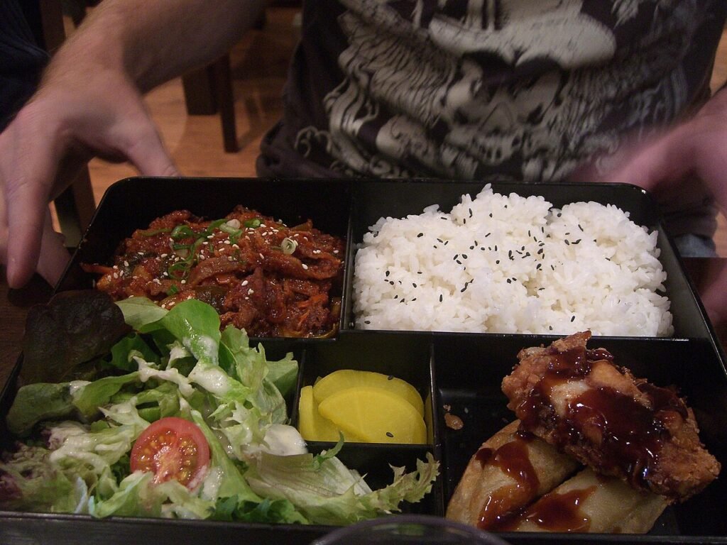 A Korean spicy pork bulgogi meal served with rice and side dishes