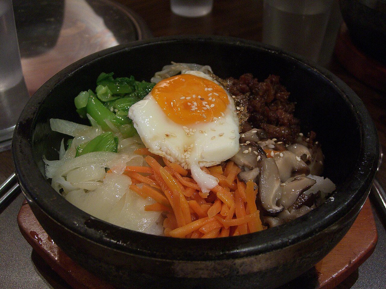 Korean pork bibimbap served with banchan side dishes