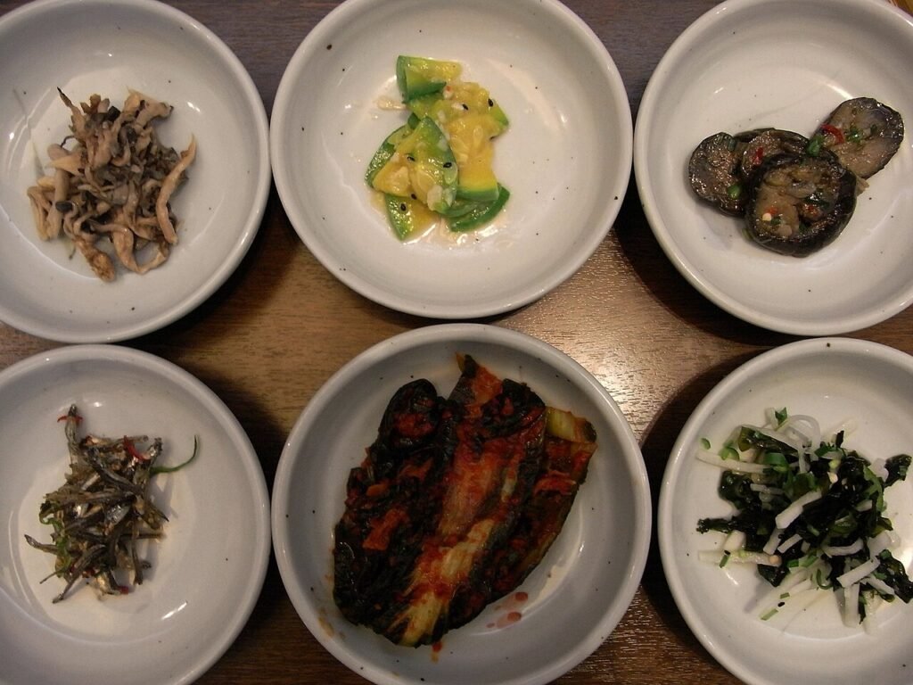 Spread of Korean banchan side dishes on a restaurant table