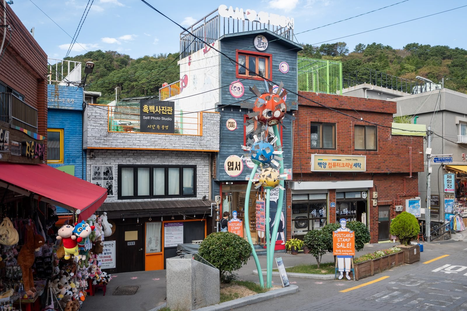 A narrow alley between colorful houses in Gamcheon Culture Village