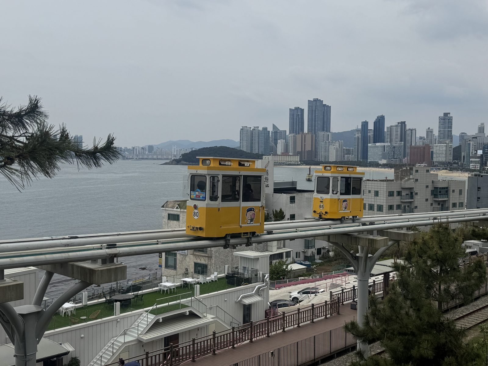 A Haeundae Blueline Park sky capsule on its elevated track above the coastline