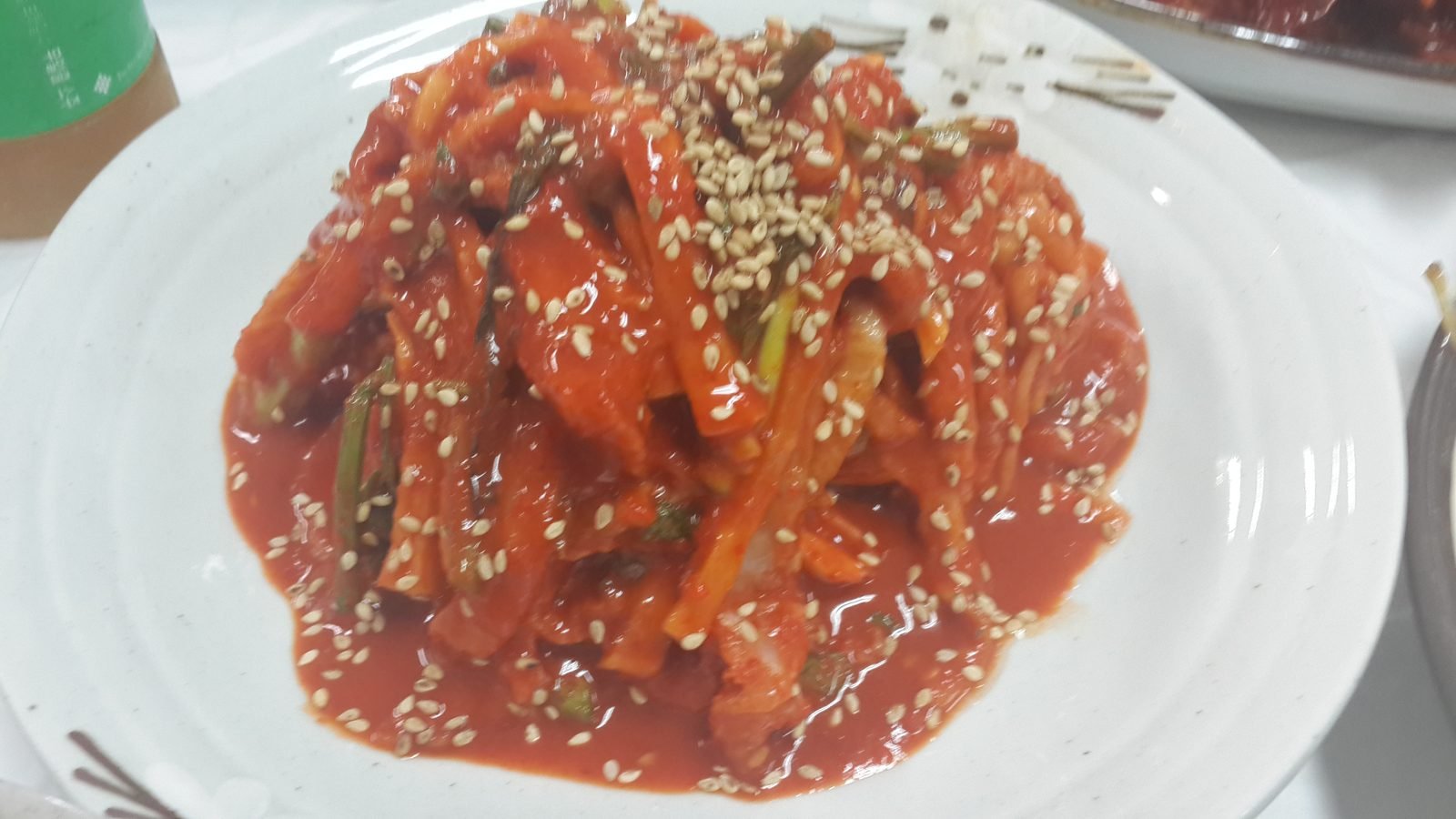 Sliced raw fish hoe served on a plate at a Korean restaurant