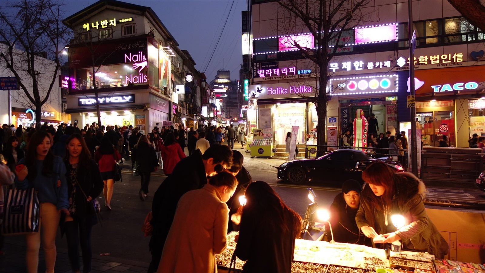 Neon-lit nightlife street in the Hongdae district of Seoul