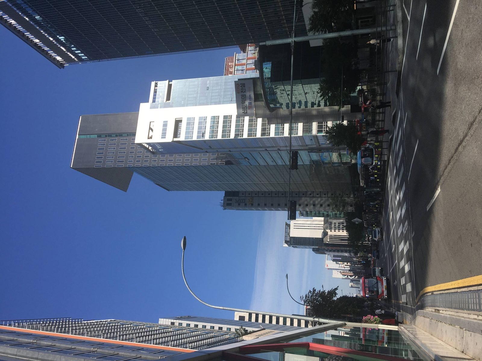 A wide street lined with buildings in Gangnam, Seoul