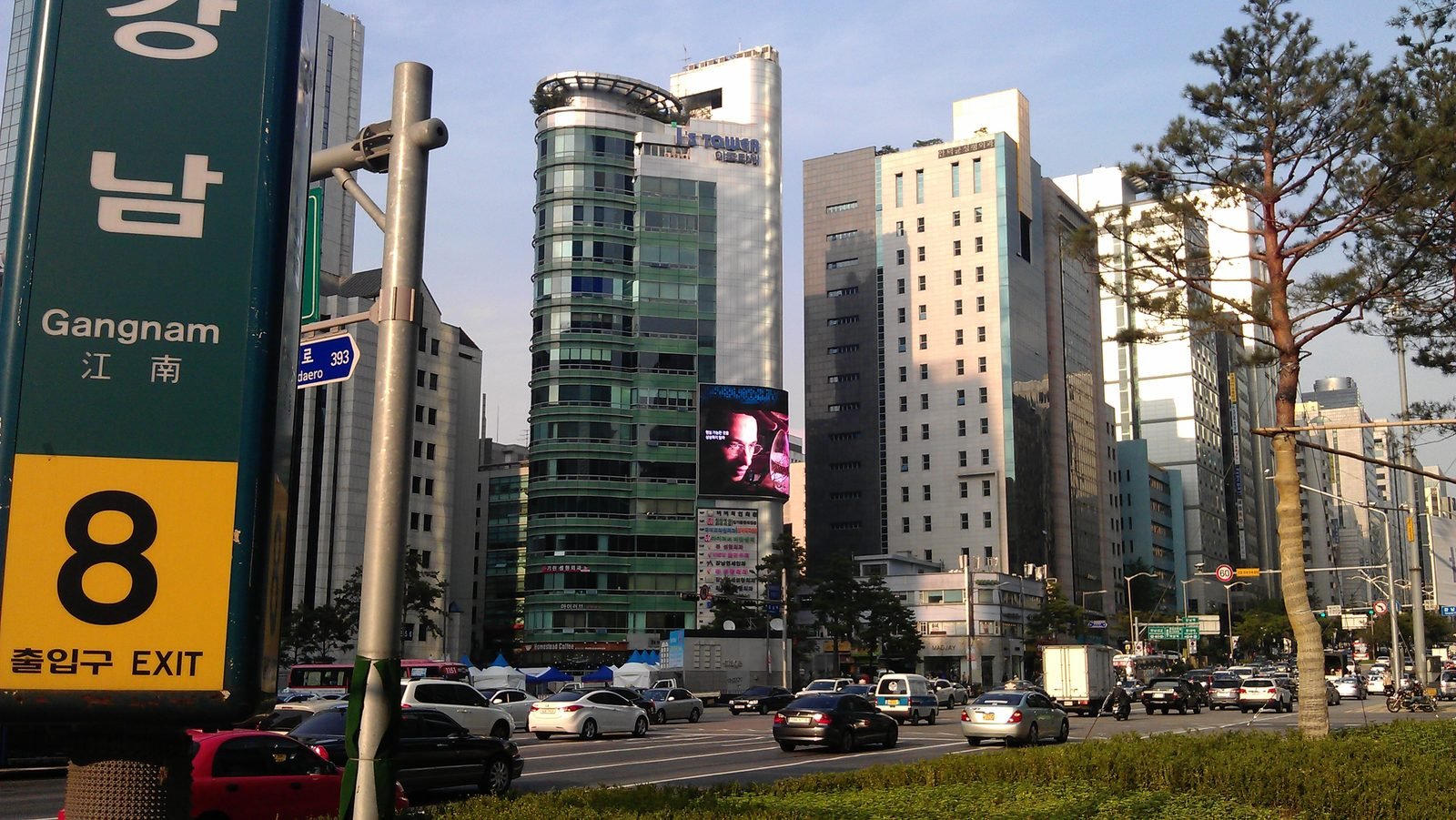 Gangnam Station exit with pedestrians on the street in Seoul