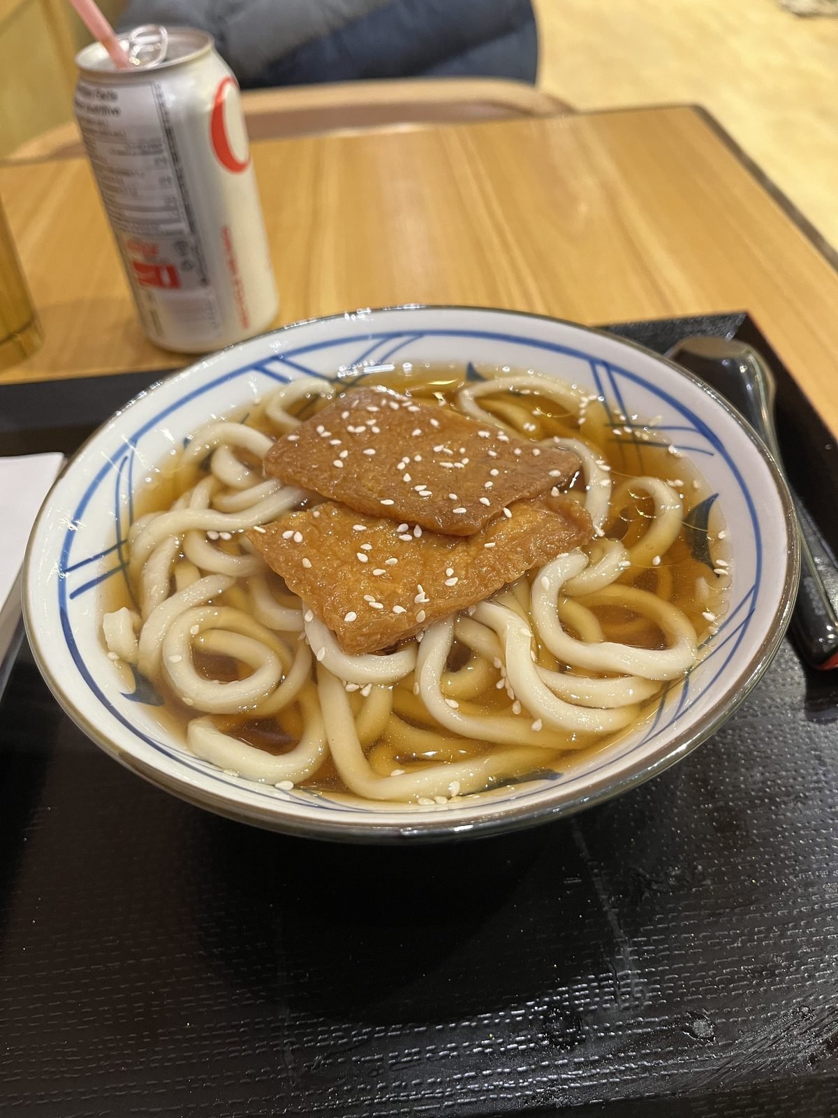 A bowl of udon noodles in broth
